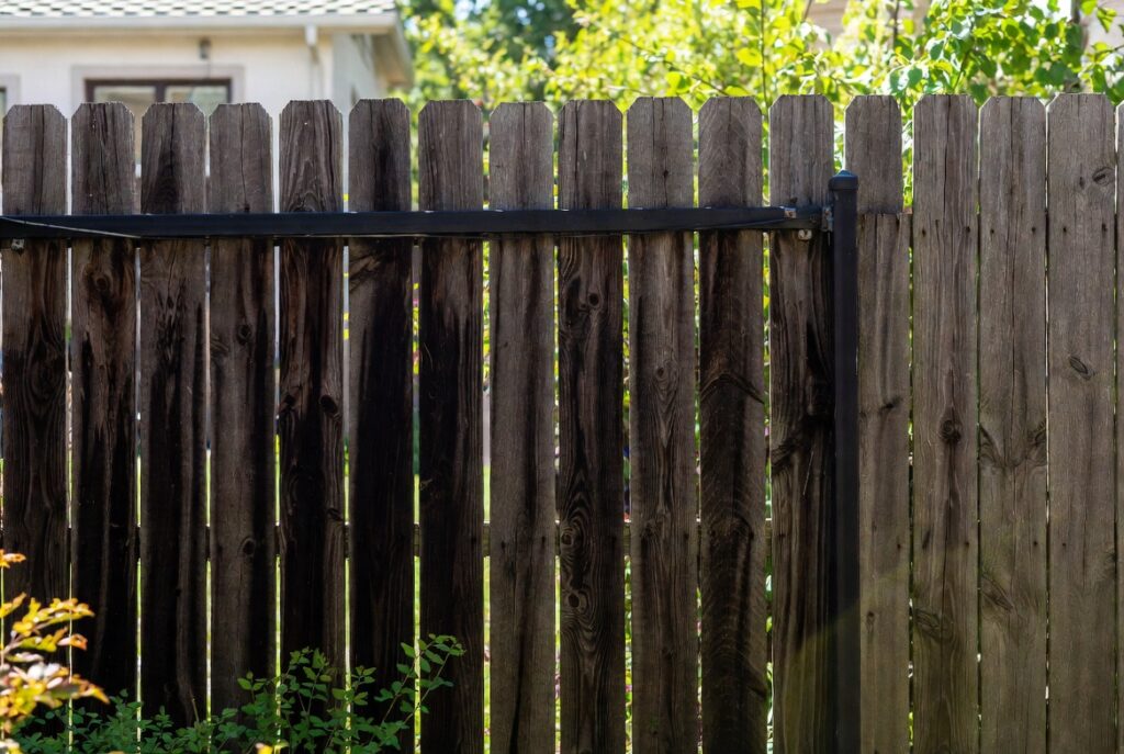 6. Dark Stained Privacy Fence