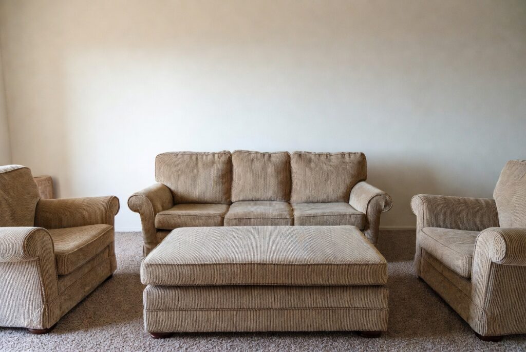 <img data-src="matching-furniture-mistake.jpg" alt="Why matching furniture sets are quietly aging your space - Common interior design mistake of using complete matching furniture sets that make rooms look dated and old-fashioned. Boring living room with identical sofa, loveseat, chairs and tables in the same style and color creating a sterile outdated look. How matching furniture sets age your home decor and reduce personality. Modern interior design tips to avoid the matching set trap and create a timeless curated space with mixed styles and textures for a fresh youthful home.">