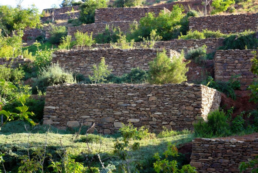 retaining wall ideas sloped yard terraced landscaping stone wall garden design