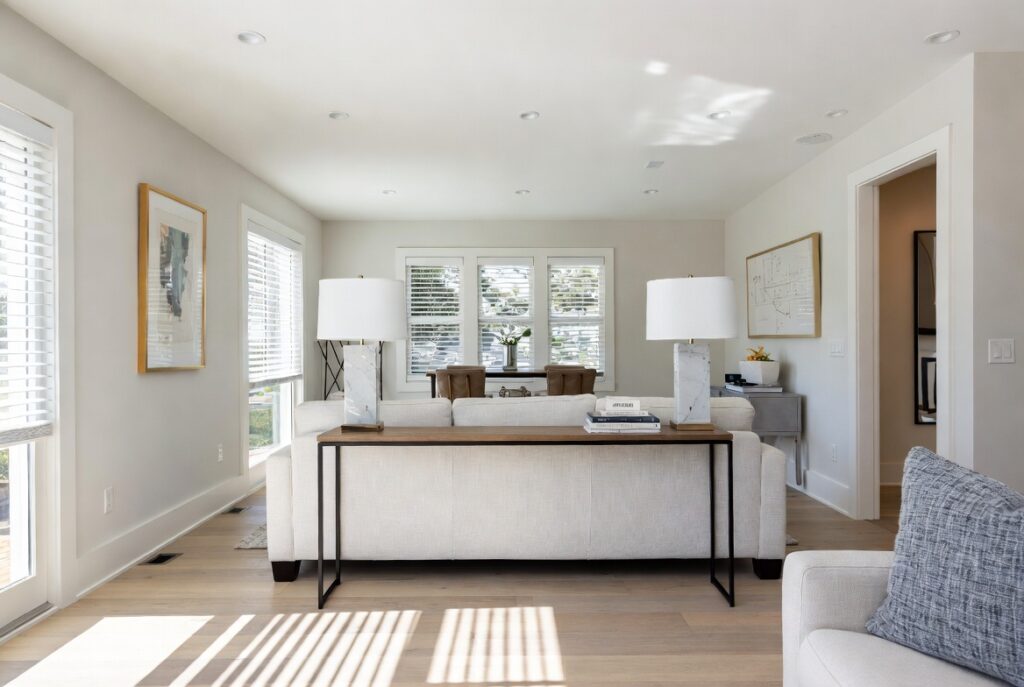 "Try a slim console table behind the sofa in small living room to save space - Narrow long console adding storage and style while keeping open airy and spacious feel"