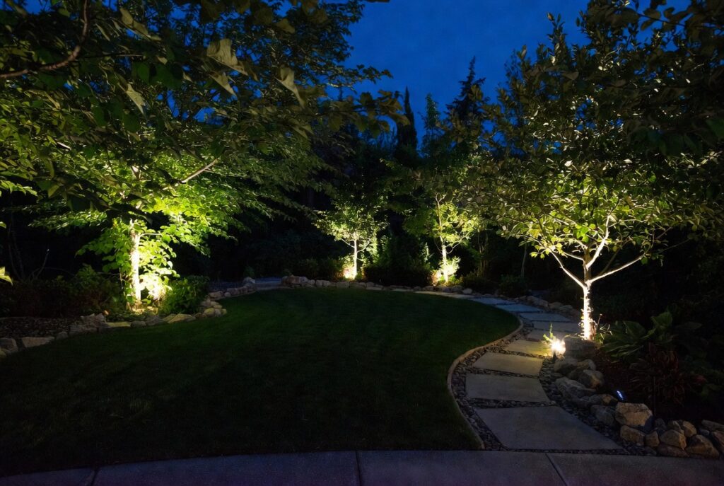 landscape lighting ideas front yard solar uplights trees night garden glow
