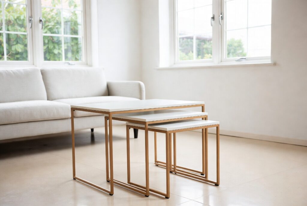 "Use nesting coffee tables in small living room to save space - Set of 3 slim light wood nesting tables creating flexible and open layout with more floor space"