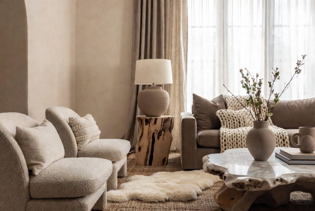 <img data-src="texture-rich-neutral-room.jpg" alt="The texture trick that makes neutral rooms feel rich - Interior design secret using layered textures to transform boring flat neutral rooms into luxurious rich spaces. Beautiful living room with mix of velvet sofa, chunky knit throws, woven baskets, linen curtains, bouclé chairs, wooden accents, marble, and sheepskin rug creating incredible depth and warmth. How adding varied textures makes beige and neutral color schemes feel expensive high-end and inviting instead of dull and cheap. Best textural layering tips for neutral home decor.">