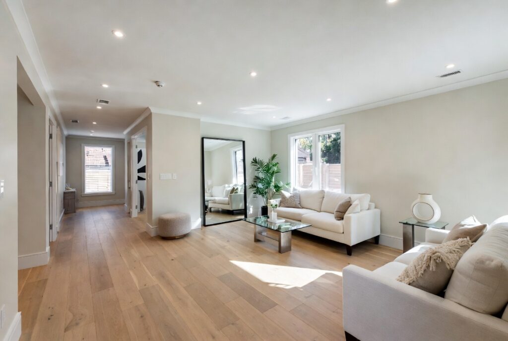 "Light paint colors for small rooms - Bright off-white and soft beige walls opening up a modern living room to feel spacious and airy with natural light"