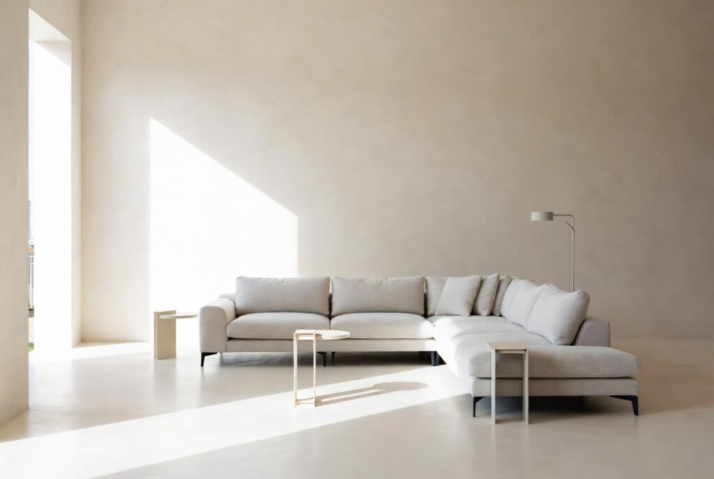 "Use one large sectional sofa instead of multiple pieces in small living room - Minimalist furniture arrangement to create more space and open feel"