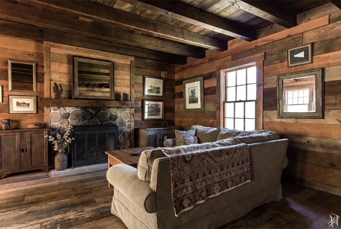 Warm rustic farmhouse living room with earthy tones layered textures and reclaimed wood