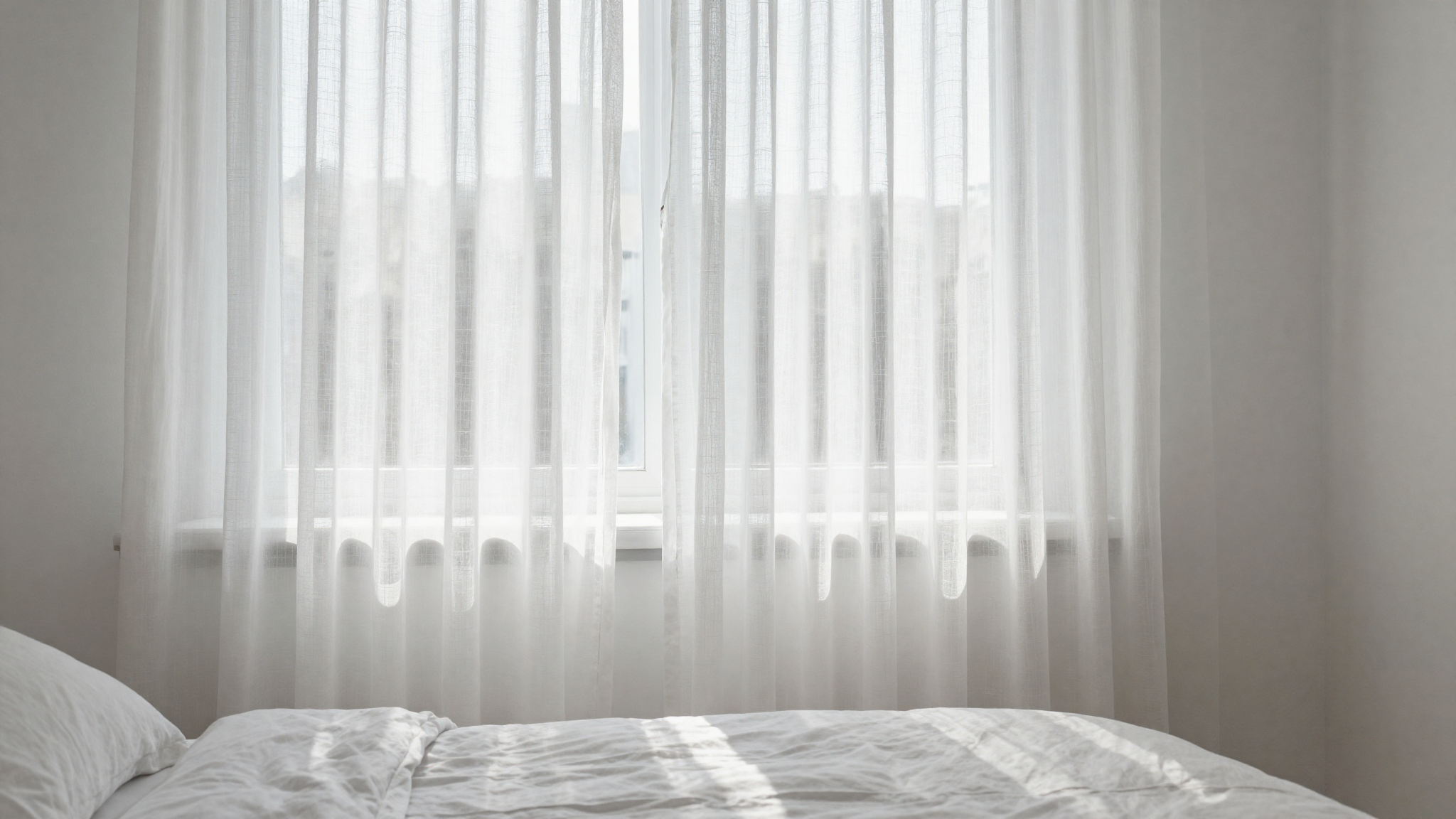 white on white bedding sheer curtains reflecting daylight