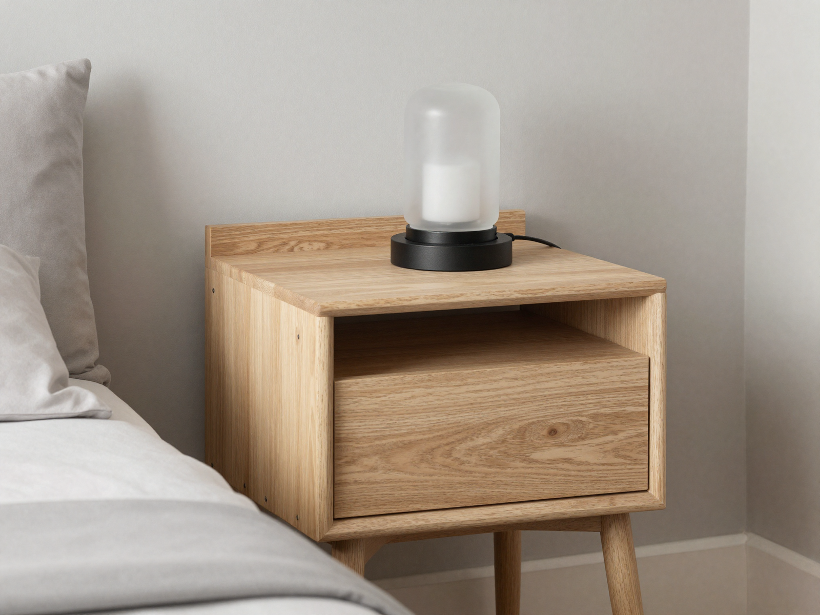 Pale pine nightstand and picture ledge with black metal accents