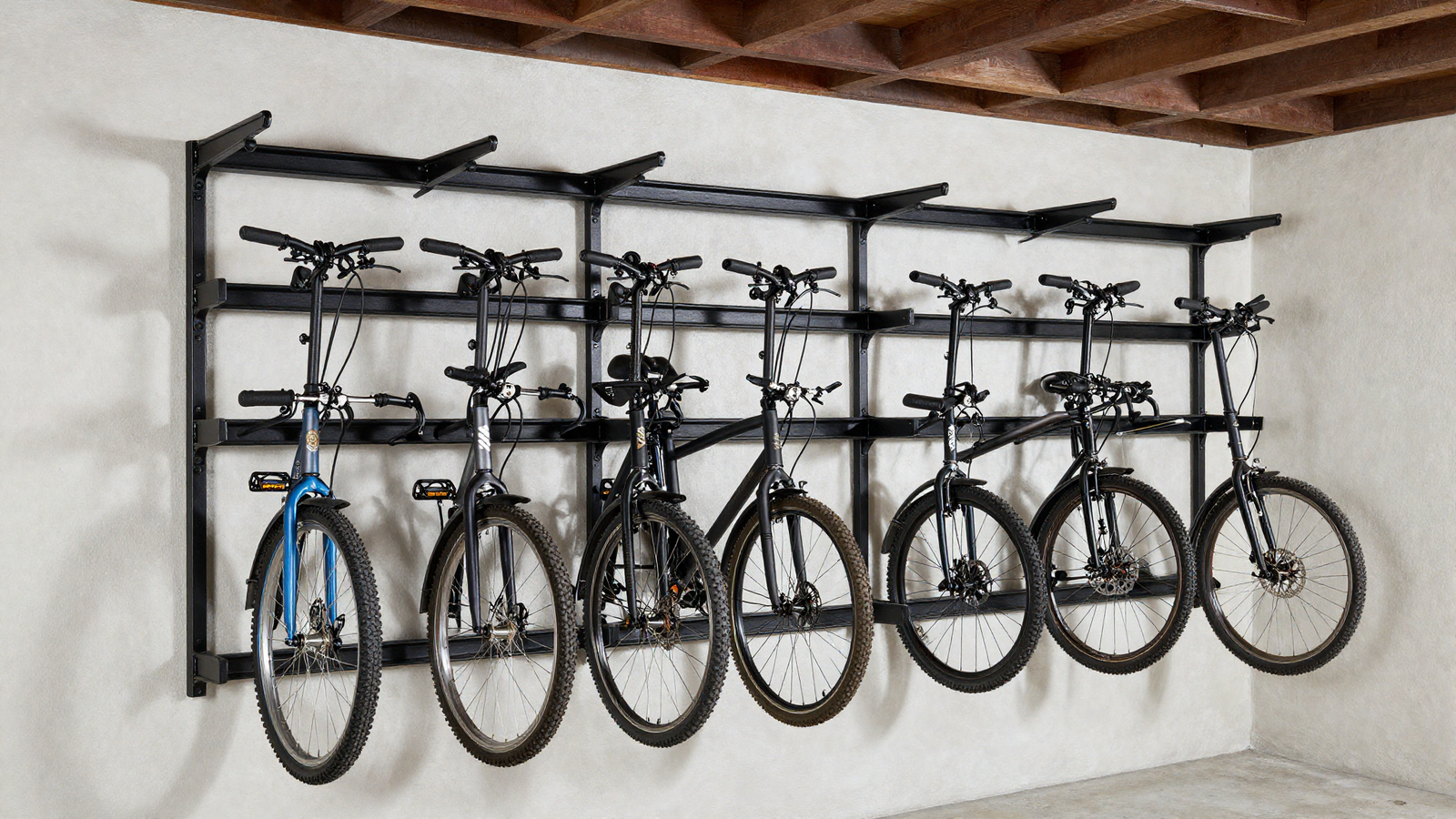 Vertical bike storage wall mount in garage with multiple bicycles hung on hooks