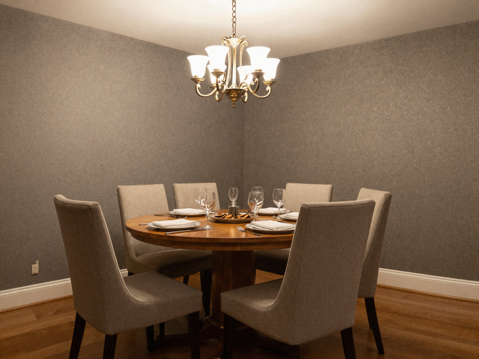 Formal dining room with wallpaper and elegant chandelier