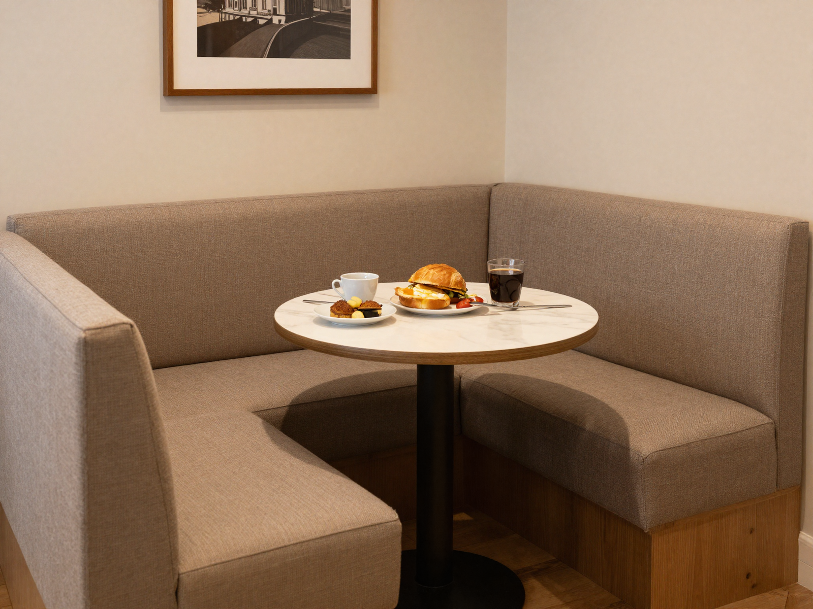 Cozy kitchen banquette nook with upholstered bench seating