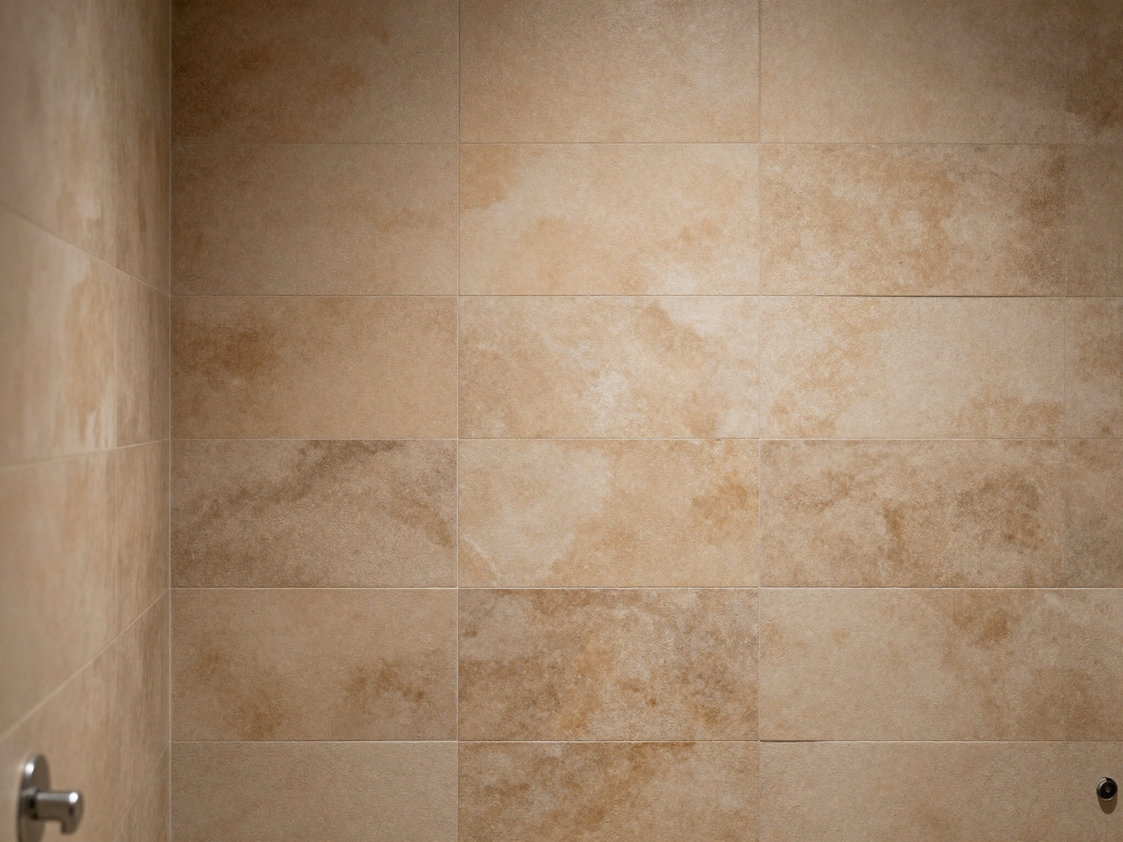 Bathroom shower wall with handmade textured earthy tile
