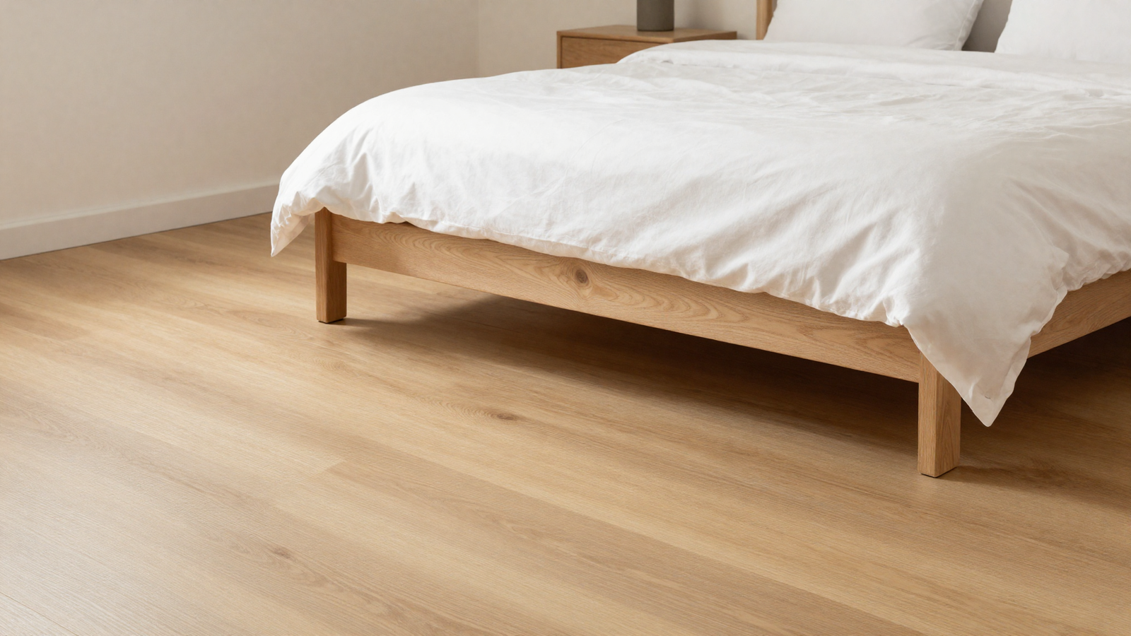 Bedroom with matte finish light oak wood flooring and organic just-sanded natural look