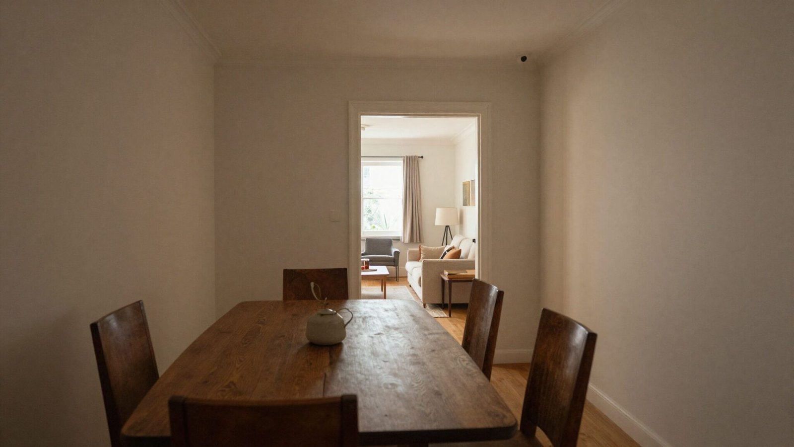 Enclosed dining room with defined walls and doorway creating an intimate atmosphere