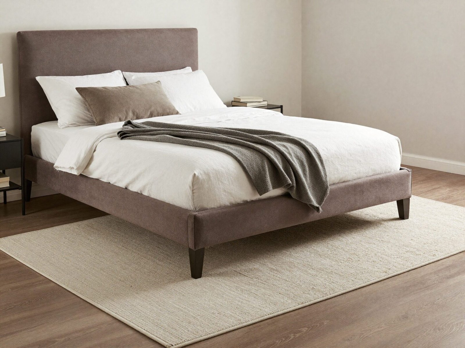 Queen bed positioned on an 8 by 10 foot area rug