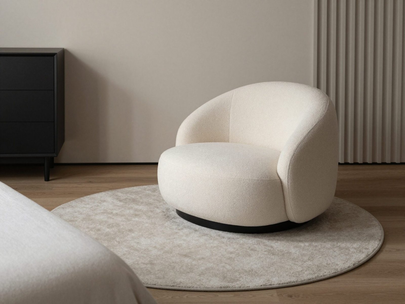 Round area rug placed under a circular accent chair in a bedroom