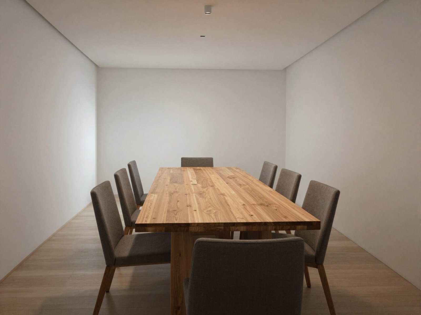 Rectangular wood dining table placed in a long, narrow dining room