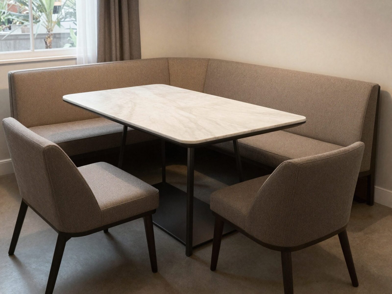 Dining table with an upholstered bench on one side and chairs on the other