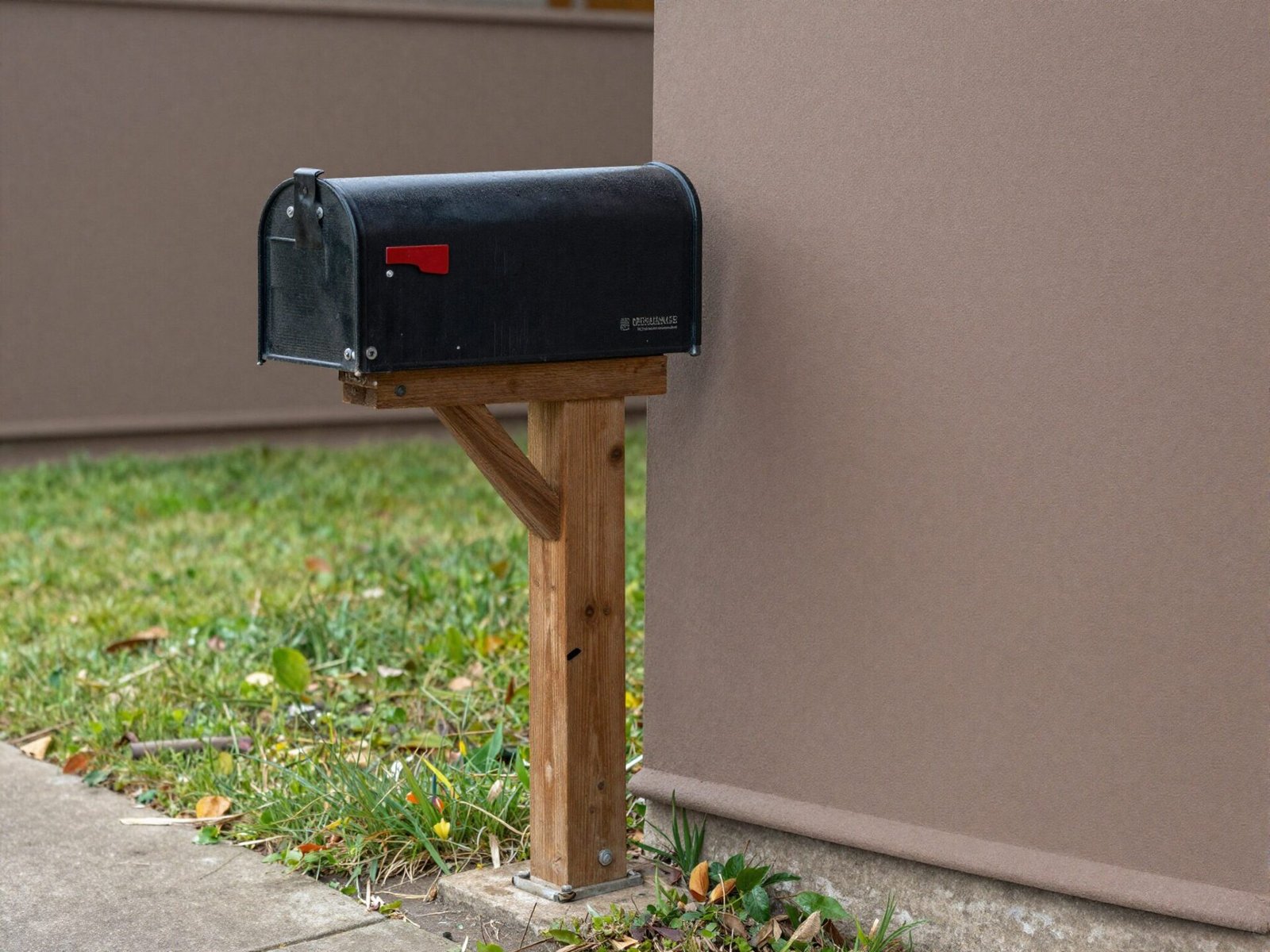Old leaning mailbox post installed at the wrong height