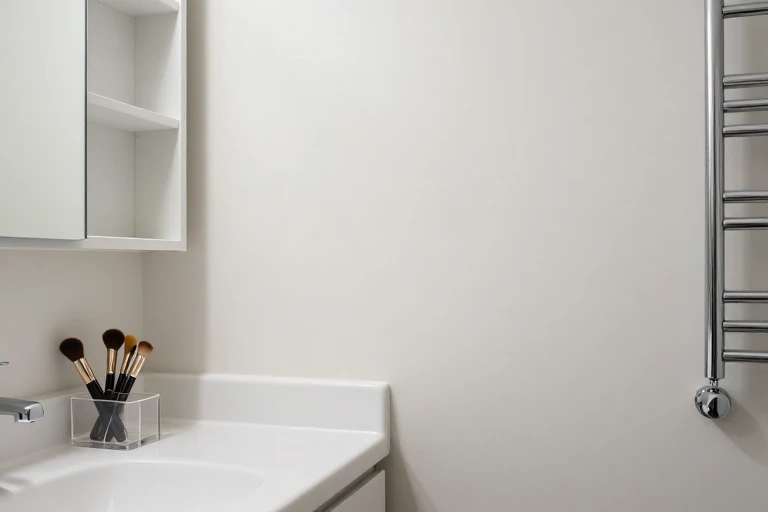 Bathroom vanity with drawer inserts, medicine cabinet organizer, and over‑door towel rack.