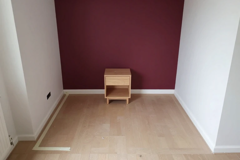 Compact bedroom planned around one burgundy focal wall